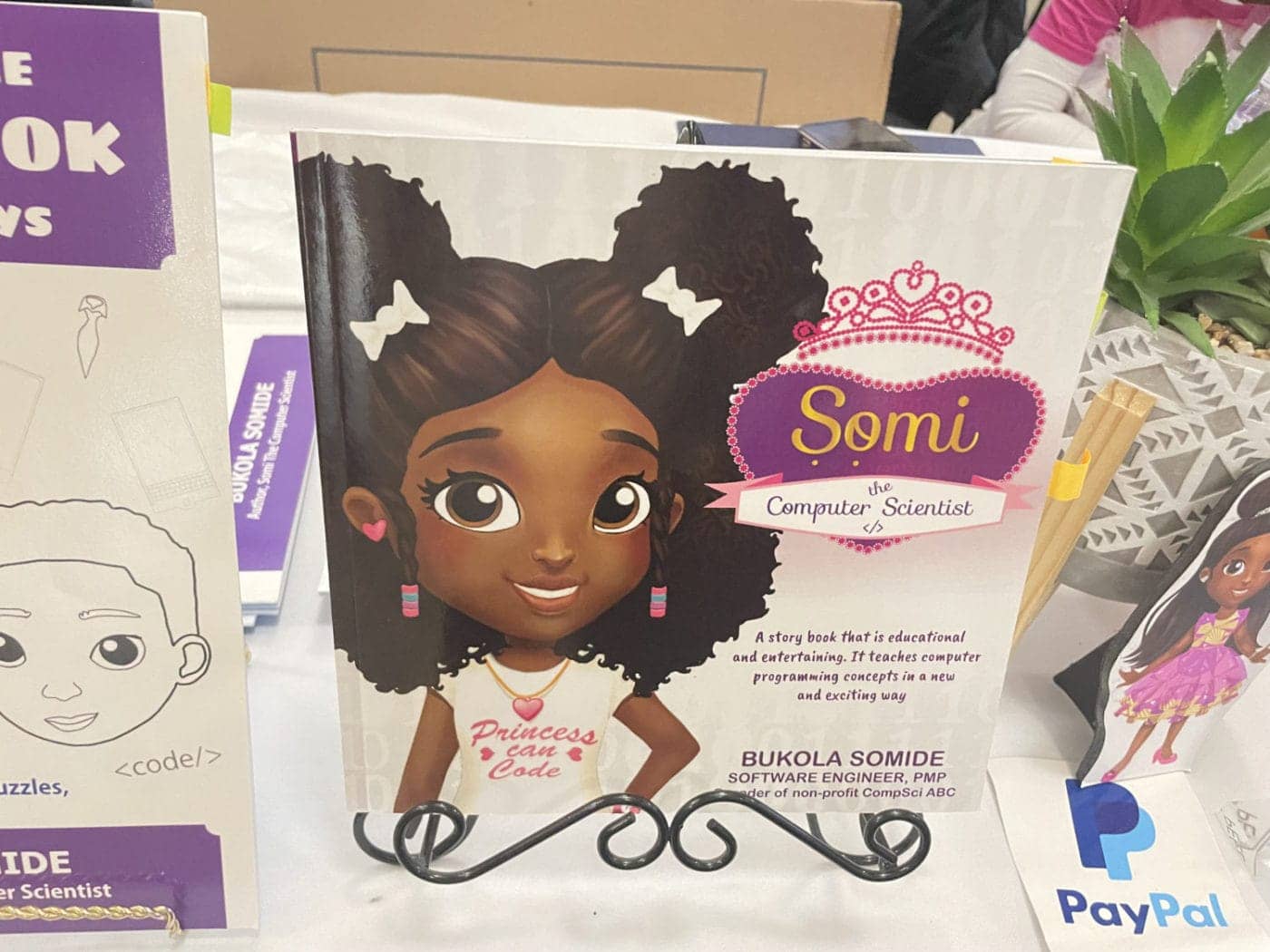 Black-Doll-Fest-speaker-Bukola-Somideas-book-AAMLO-110423-by-Daphne-1400x1050, Black Doll Festival visits Oakland’s African American Museum, Culture Currents World News & Views 